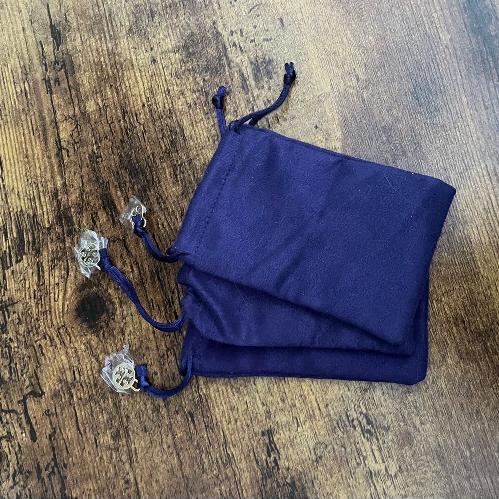 Three small Tory Burch jewelry pouches